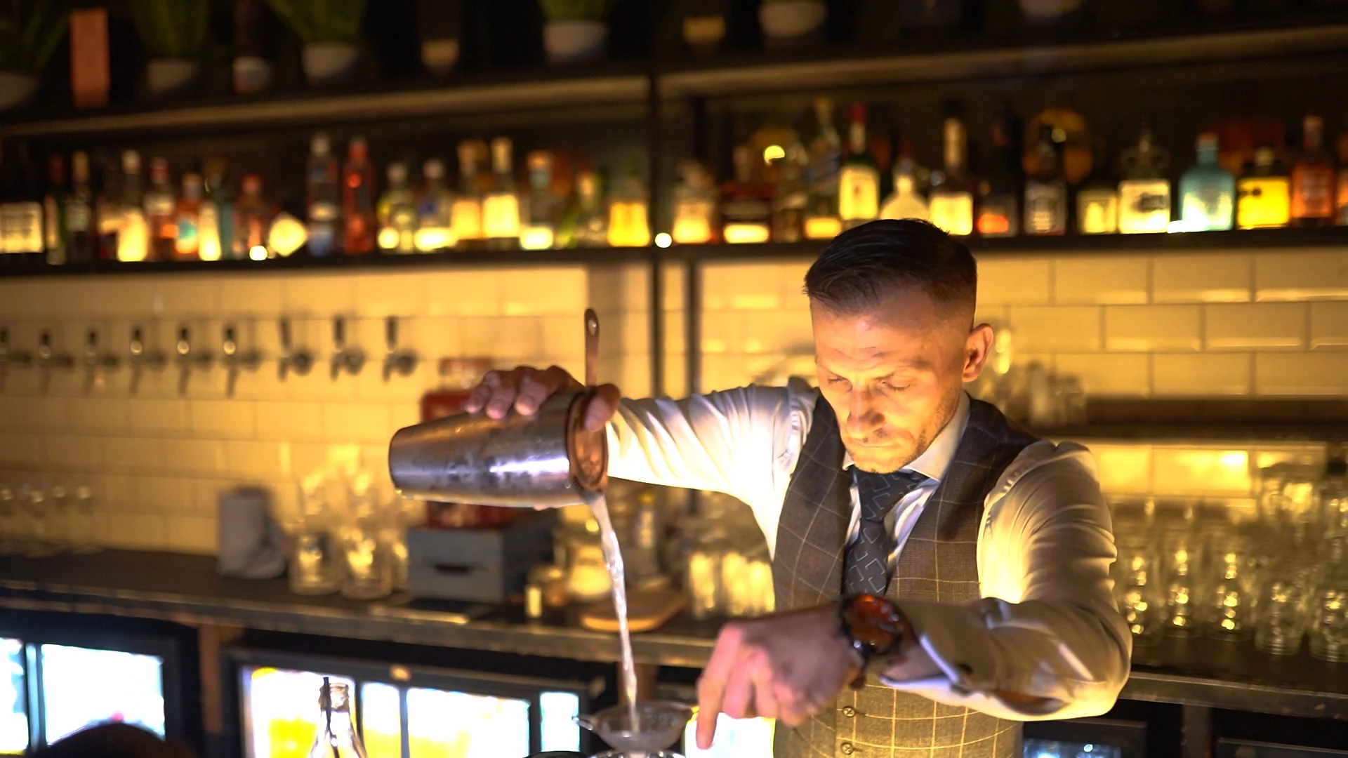 Bartender preparing a cocktail at Monika Restaurant