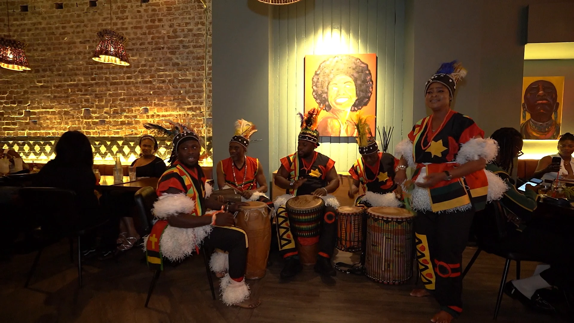 Dancer performing alongside live drummers at Monika Restaurant