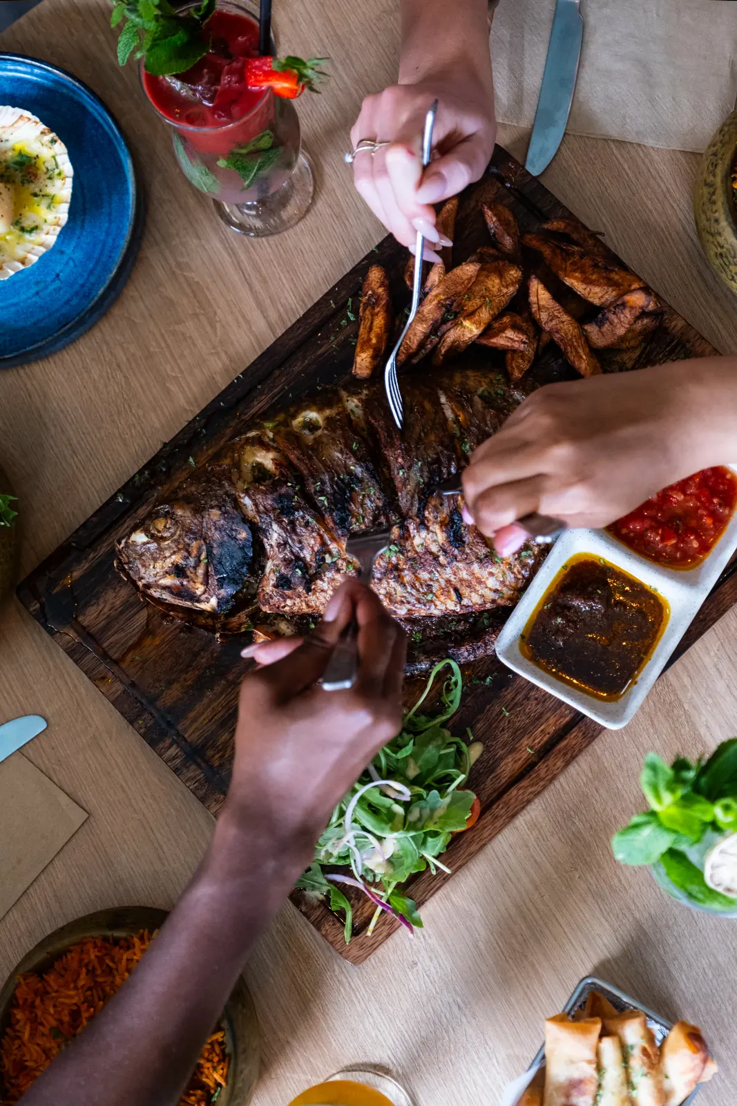 Sharing grilled fish at the table